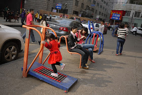 girl running on a treadmill outside in Changsha, China