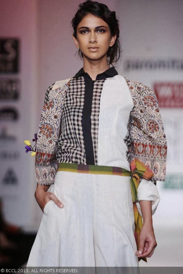 A model showcase a creation by fashion designer Paromita Banerjee on Day 2 of Wills Lifestyle India Fashion Week (WIFW) Spring/Summer 2014, held in Delhi.