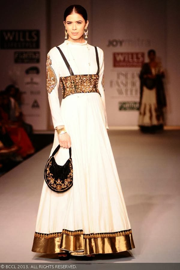 Sucheta Sharma showcases a creation by fashion designer Joy Mitra on Day 5 of Wills Lifestyle India Fashion Week (WIFW) Spring/Summer 2014, held in Delhi.