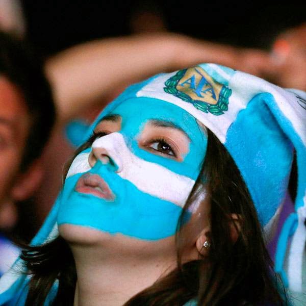 Fans of Argentina react after Germany scored a goal, during a public viewing of the 2014 Brazil World Cup final match, in Rio de Janeiro July 13, 2014.