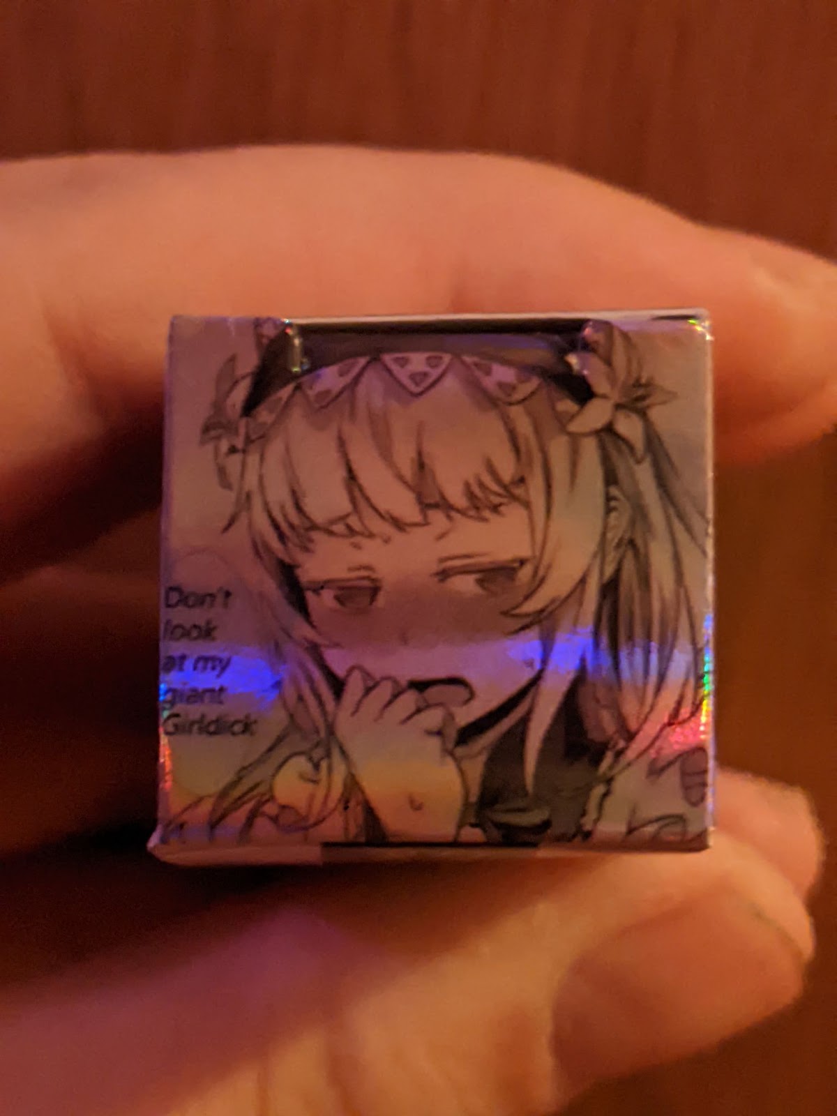 an estradiol injection bottle depicting an anime girl saying "Don't look at my giant Girldick"