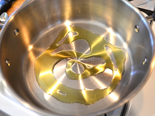 heating olive oil in pot 