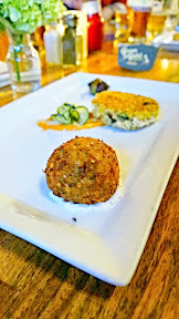 Kells Brew Pub dinner, a vegetarian sampling of the Wee Plates included steamed leek wrapped fig stuffed with goat cheese, a polenta cake with the chipotle remoulade and house made pickles, and a dense and moist housemade falafal fritter with tzatziki Paired with the Kells Irish Lager
