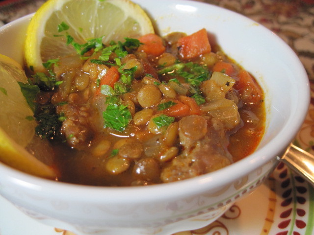 A bowl of Lentil Stew with carrots and parsley.