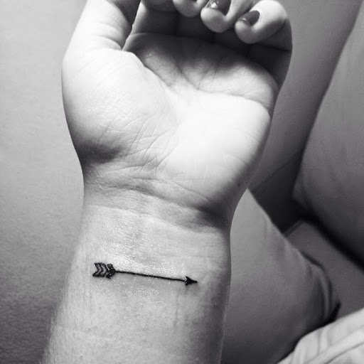 arrow small tattoo on the wrist