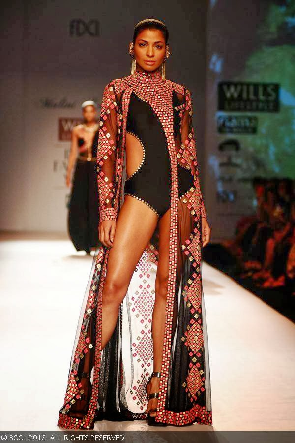 Donna showcases a creation by fashion designer Malini Ramani on Day 1 of Wills Lifestyle India Fashion Week (WIFW) Spring/Summer 2014, held in Delhi.