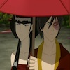 Mai and Zuko under a red umbrella, looking annoyed