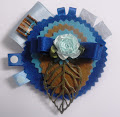 190-Florecilla azul sobre marrón y azules con filigrana