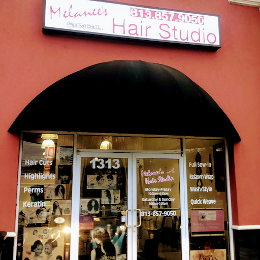 Melanee's Hair Studio logo