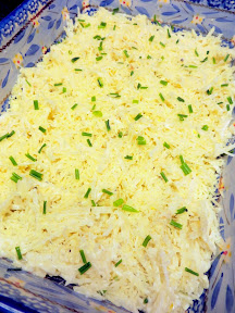 Recipe for Chive and Onion Hash Brown Potatoes, layer a third of the hash brown mixture, then 2/3 cup cheese, and then minced chives times 3