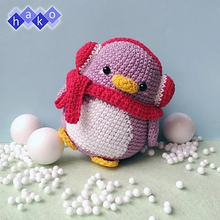 purple crochet penguin with scarf and earmuffs