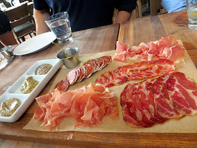 Charcuterie Plate, Manhattan Beach Post restaurant, Manhattan Beach, Los Angeles.  The cured meats included La Quercia Spec, an applewood smoked americano prosciutto raised by Heritage Acres; Picante Salami, by Cristiano Creminielli from Utah; La Quercia 'Tamworth' Prosciutto and also  La Quercia 'Acorn Edition' Coppa, both raised by Russ Kremer from Czarks, Missouri; and Cabacero de Iberico de Bellota Puro from Extremadora, Spain. The mustard selection included pink pepercorn, stout, and redwine mustards