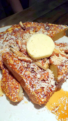 Insanely large platters in Vegas! This is the Pecan Raisin French Toast with Granello's cinnamon raisin brioche, caramelized banana, and coconut butter, from Della's Kitchen in the Delano, Las Vegas
