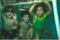 Image of Children under water. Five Reasons Your Child Should Take Swim Lessons This Summer