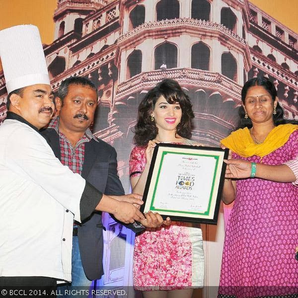 Tamannaah Bhatia presents Best North Indian(Casual Dining) award to the team of Khaan Saab during the Times Food Guide & Nightlife awards 2014, held at HICC, Madhapur in Hyderabad.