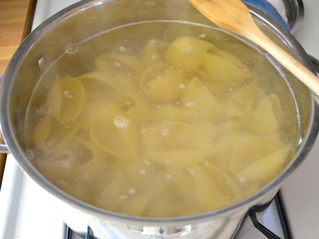 pasta cooking in boiling water in pot 