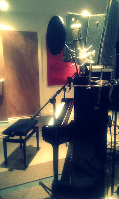the studio piano and the vocal mic, a portrait