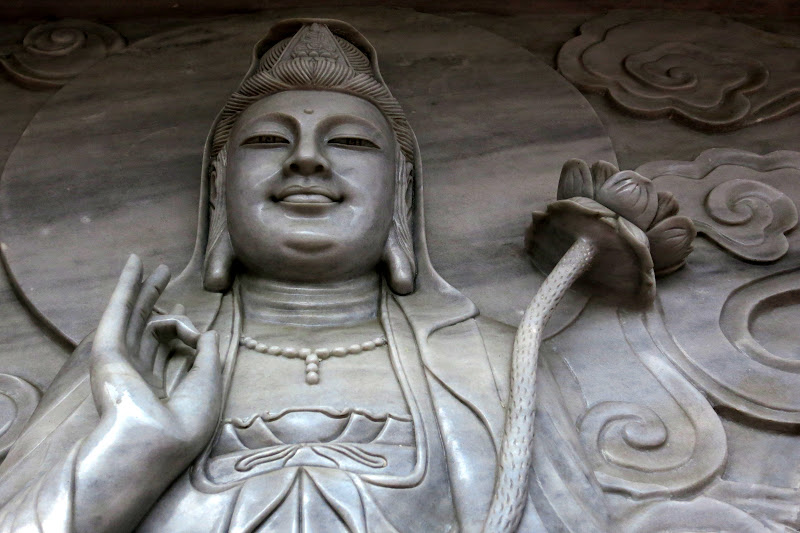 Carvings at base of Bodhisattva Statue of Mercy