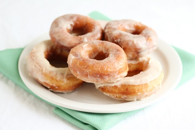 photo of a plate of glazed donuts