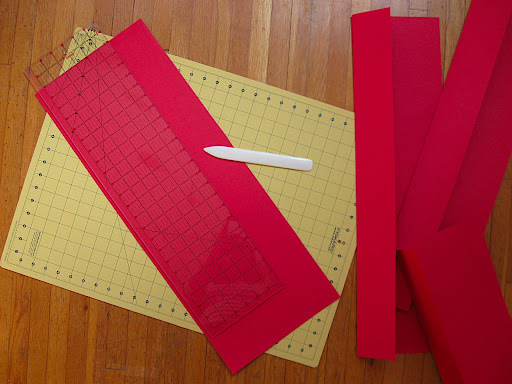 Cut a sheet of Canson Mi-Teintes paper in half lengthwise, score the bottom three inches, and fold up. Cut a sheet of Canson Mi-Teintes paper in half lengthwise, score the bottom three inches, and fold up.