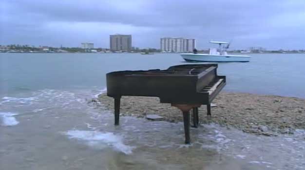 The piano spends its last day on the sandbar.
