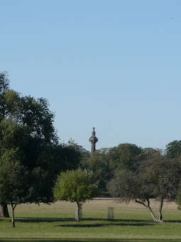 Cokes Monument appears above the trees