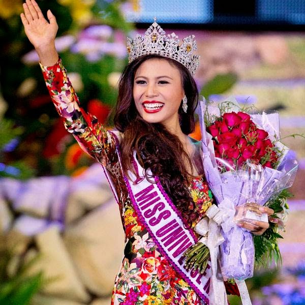 Sharr Htut Eaindra waves after winning Miss Universe Myanmar title in Yangon, Myanmar, Saturday, July 26, 2014.