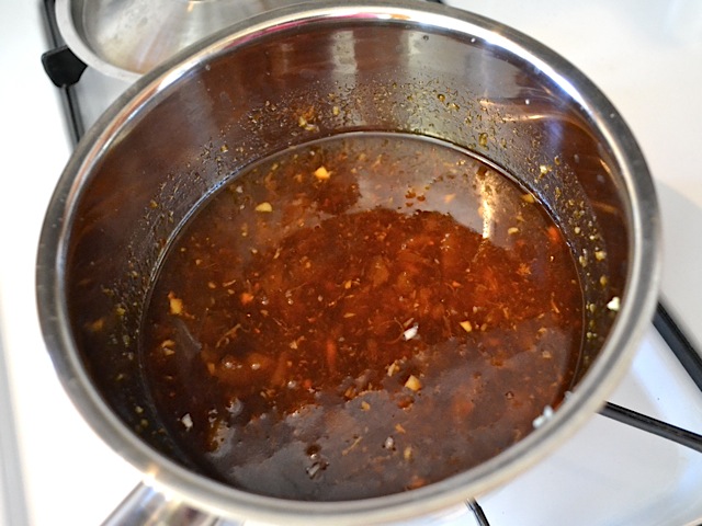 pineapple teriyaki sauce ingredients added into pot 