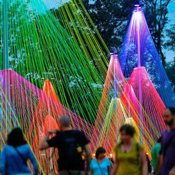 Revellers walk past an art installation during the 39th Paleo Festival in Nyon July 23, 2014. 