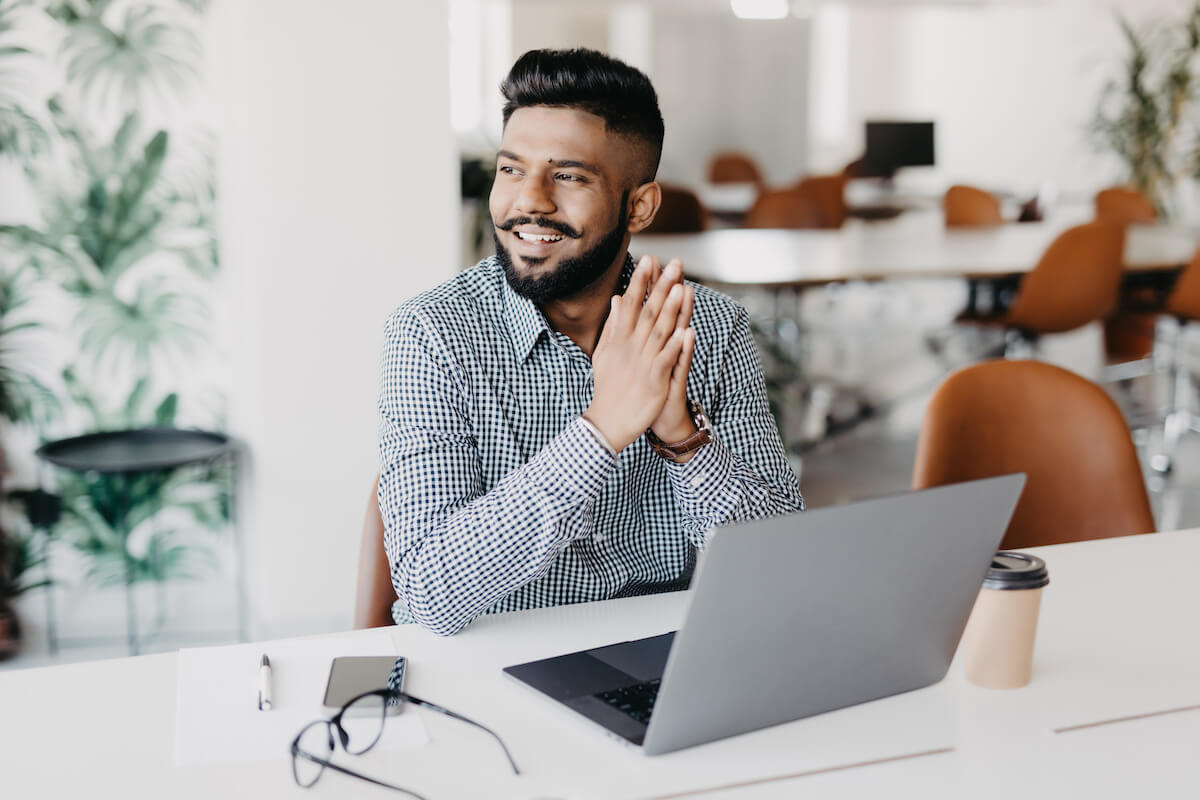 Patient activation measures: entrepreneur happily working at an office