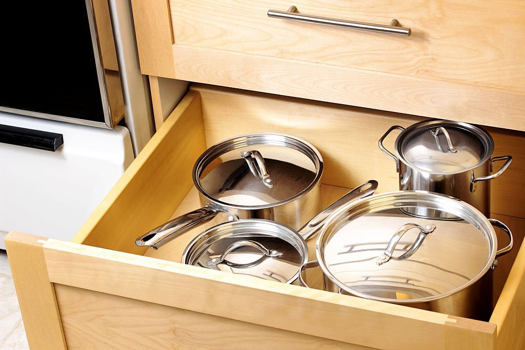 organize pots and pans in cabinet