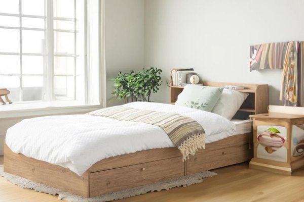 Wooden super single bed frame with a storage headboard and under bed storage.