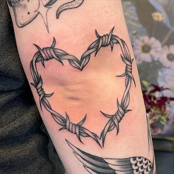 Close view of the heart barbed wire tattoo