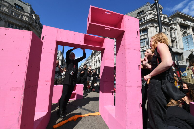The pink structure was meant to be a table and is quickly being built in Oxford Circus