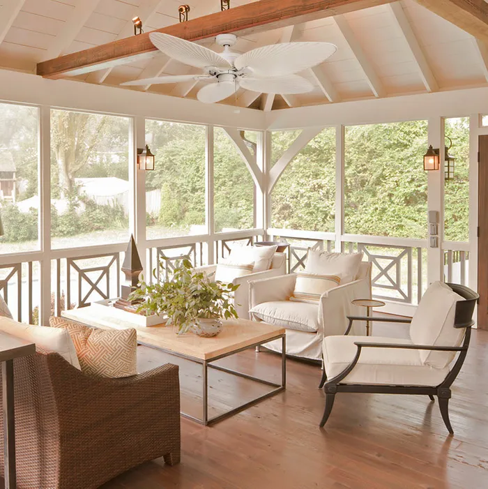 Covered patio or lanai with comfortable seating and a ceiling fan to keep a cool home without warming the planet