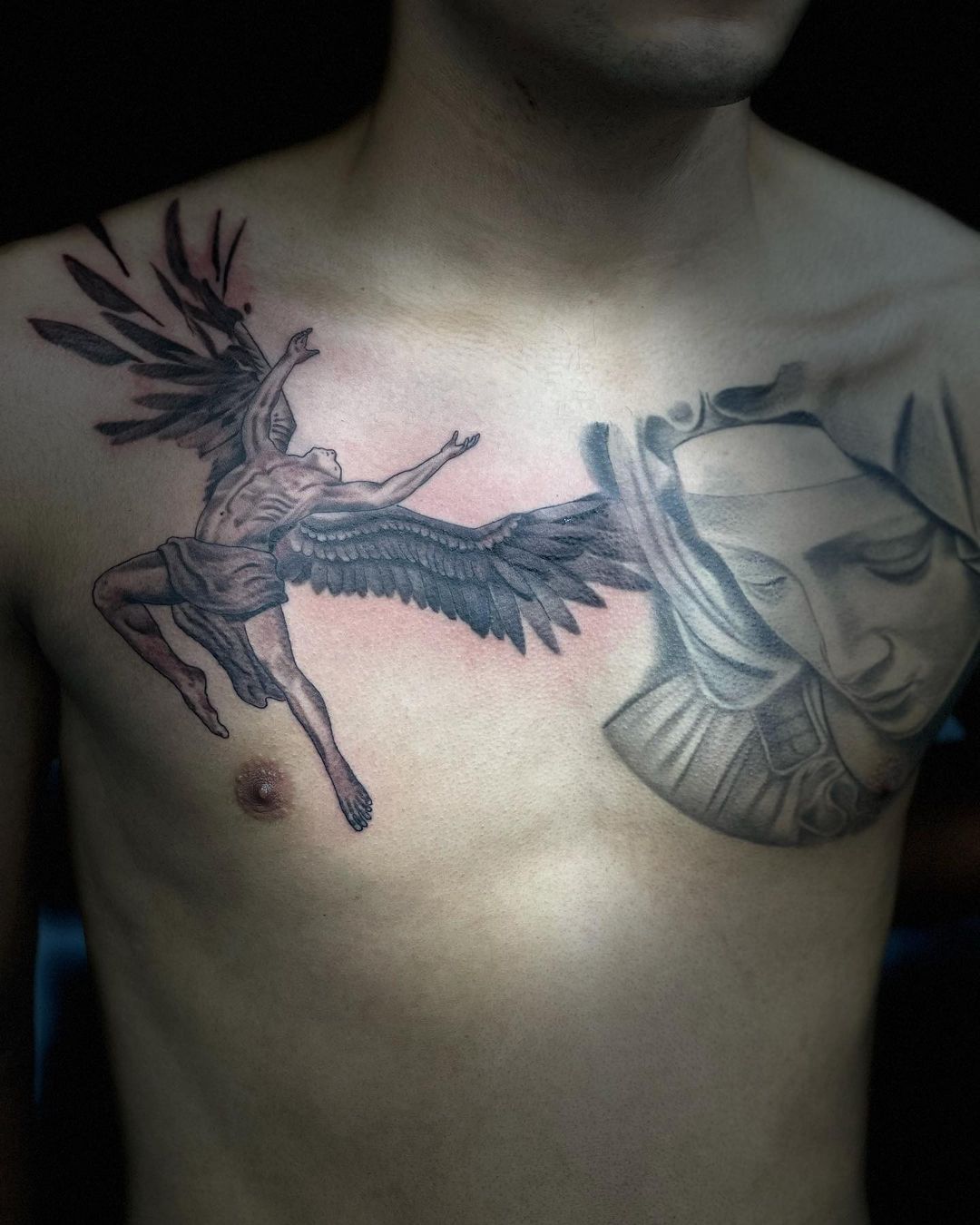 Virgin Mary And Angel Tattoo On Man Chest
