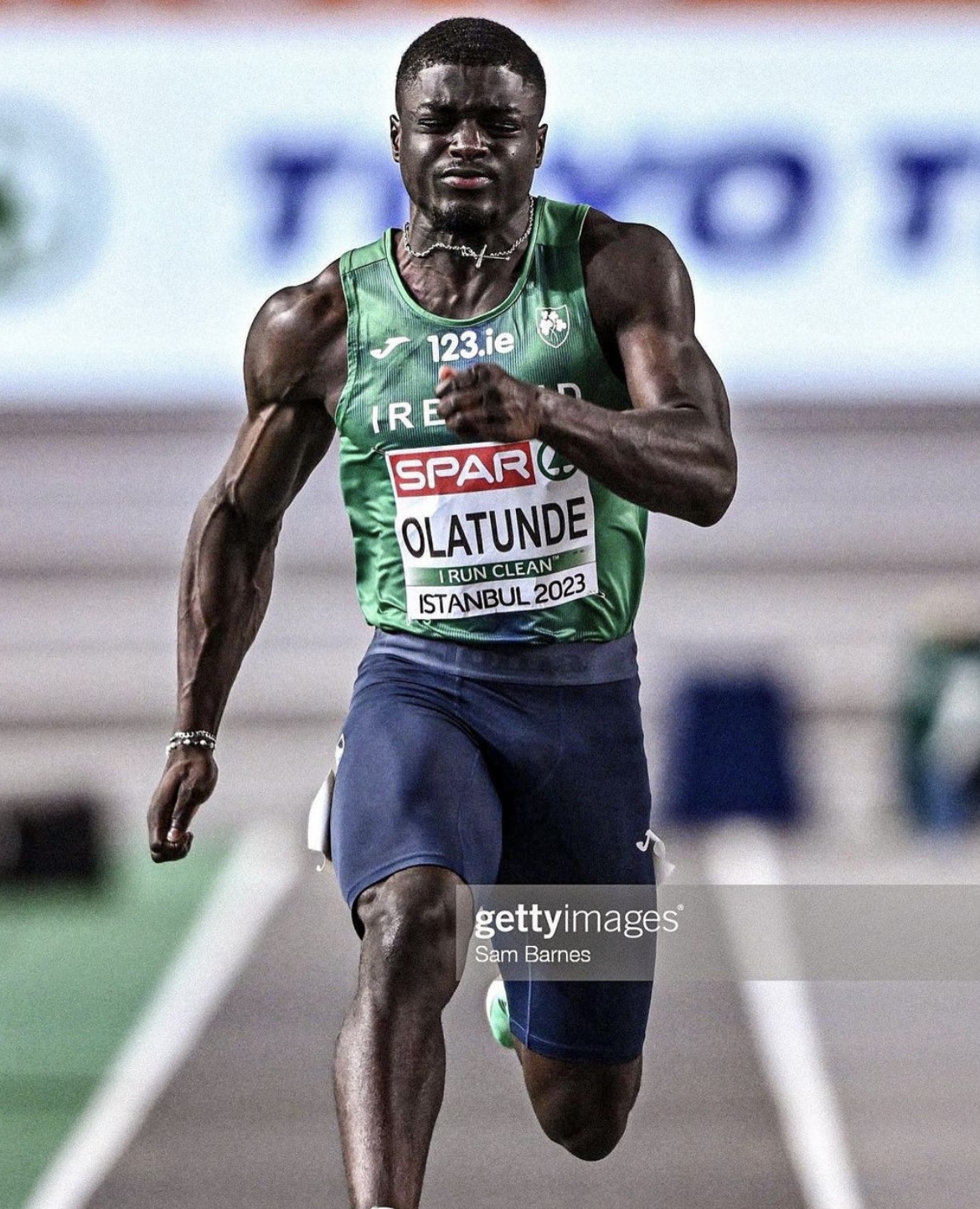 Israel Olatunde running during a race
