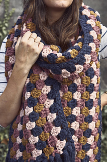 woman wearing a chunky granny stitch scarf