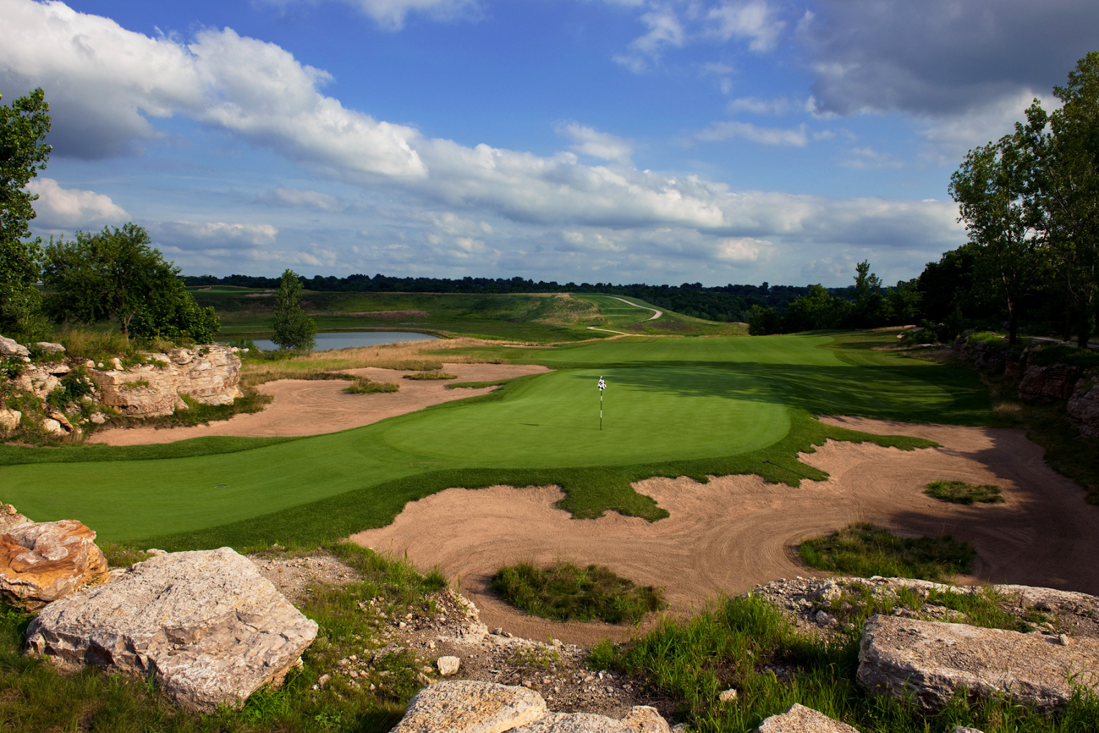Stone and rock formations can enhance visual harmony as focal points and add challenges to golf courses.