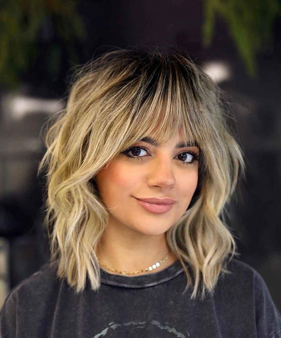 A beautiful white lady wearing a shag short hairstyle for women