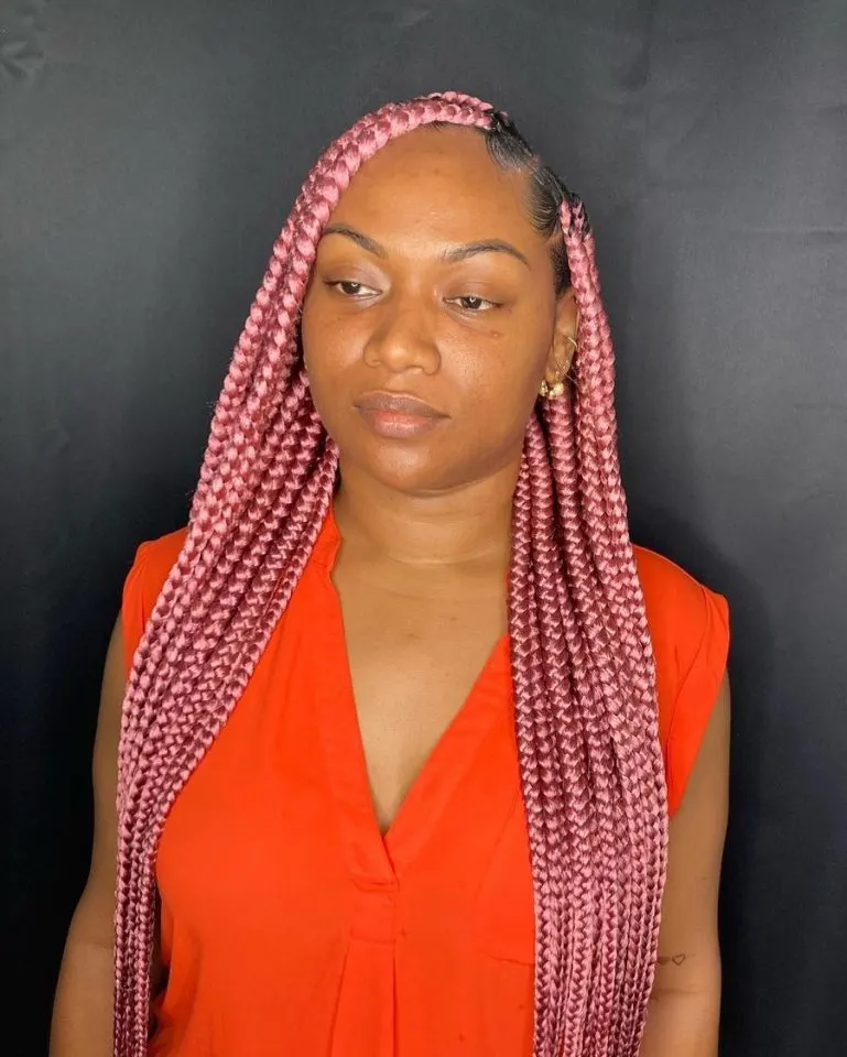 Lady poses with her pink braids in all her glory