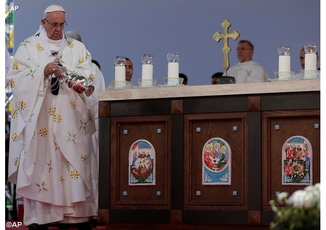 Pope Francis spreads incense on the altar as he celebrates a Mass in Tbilisi's stadium, Georgia, Saturday, Oct. 1, 2016. - AP