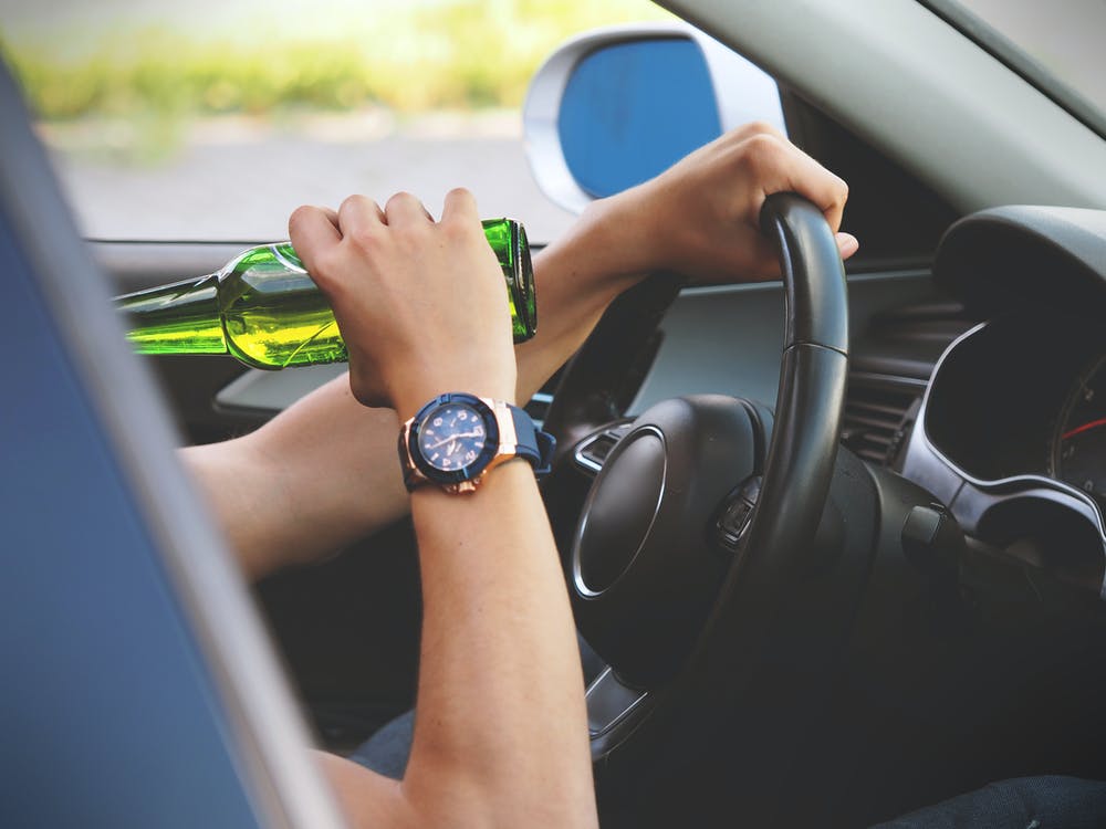 Person Driving and Drinking