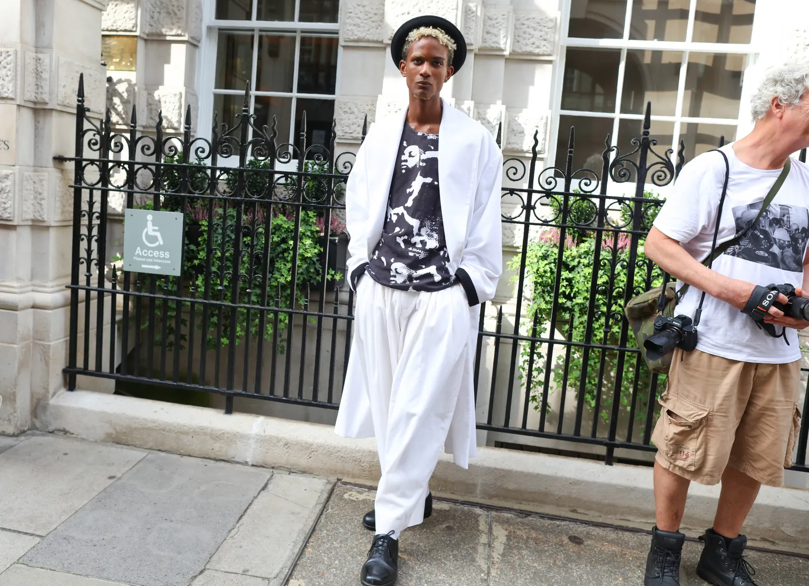 Another look at a guy rocking a white and white ensemble for London fashion week 2023