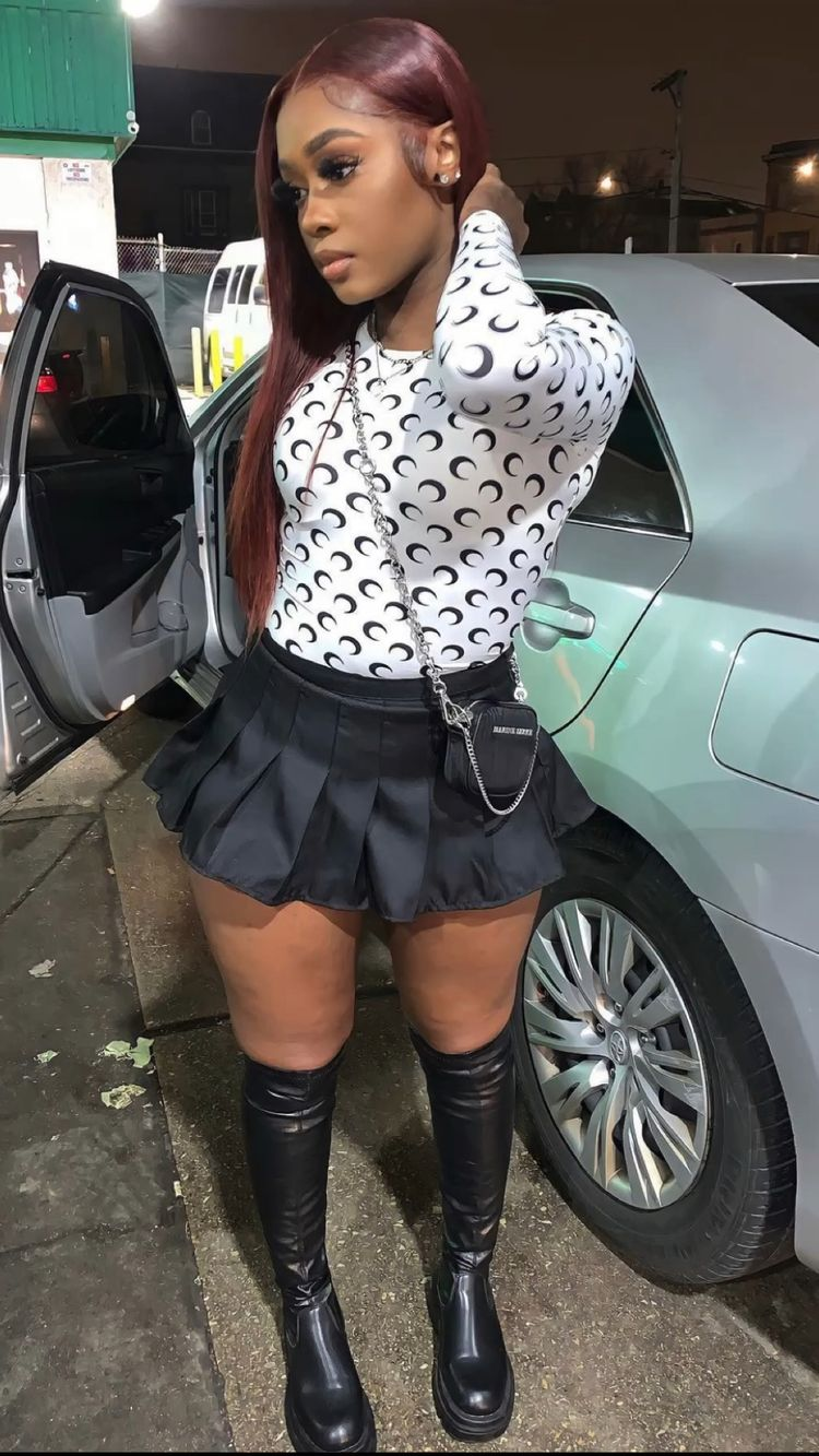 lady wearing to with white black micro mini skirt