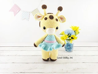 small crochet giraffe with dress