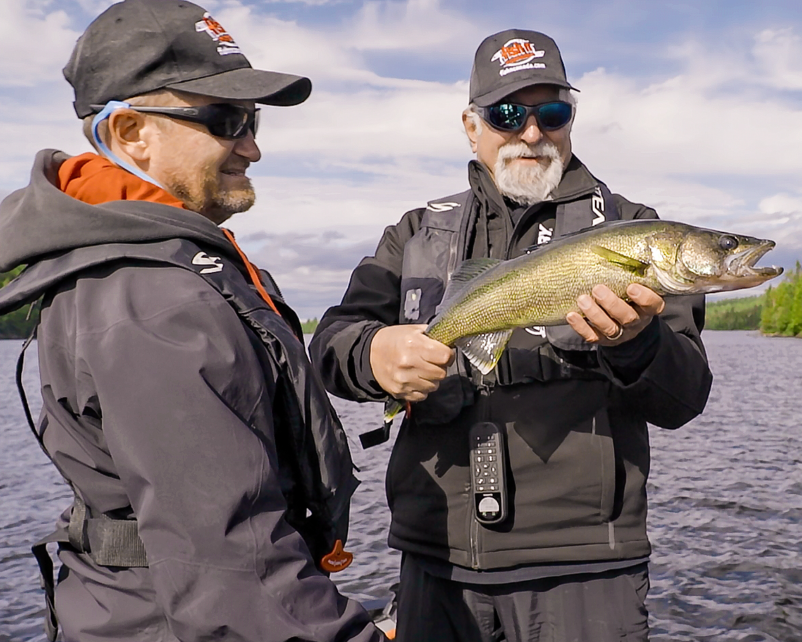 Angelo and Pete admiring a freshly caught Lady Evelyn Lake Walleye at Garden Island Lodge