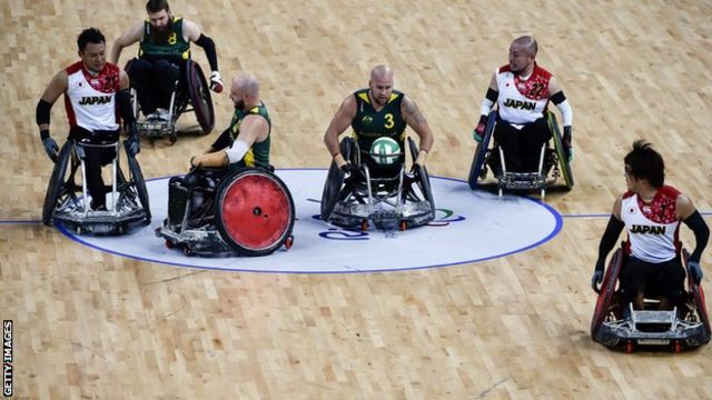 Wheelchair rugby players from Australia and Japan compete during the semi-final at the Rio Paralympic Games