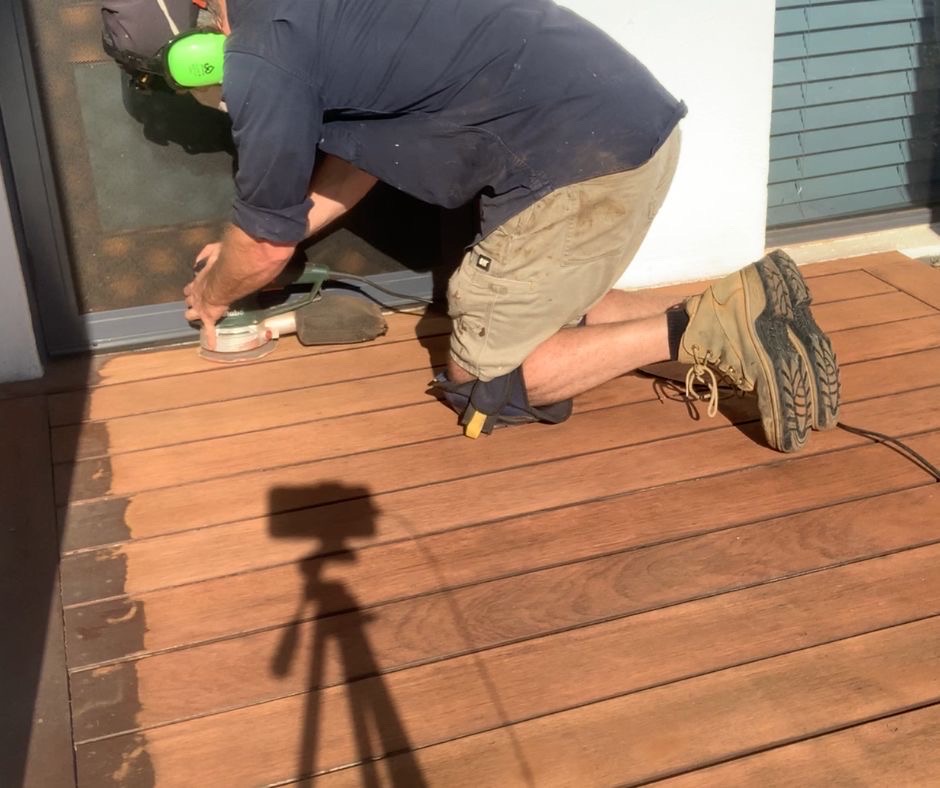 Remove deck paint along the edges with a orbital sander