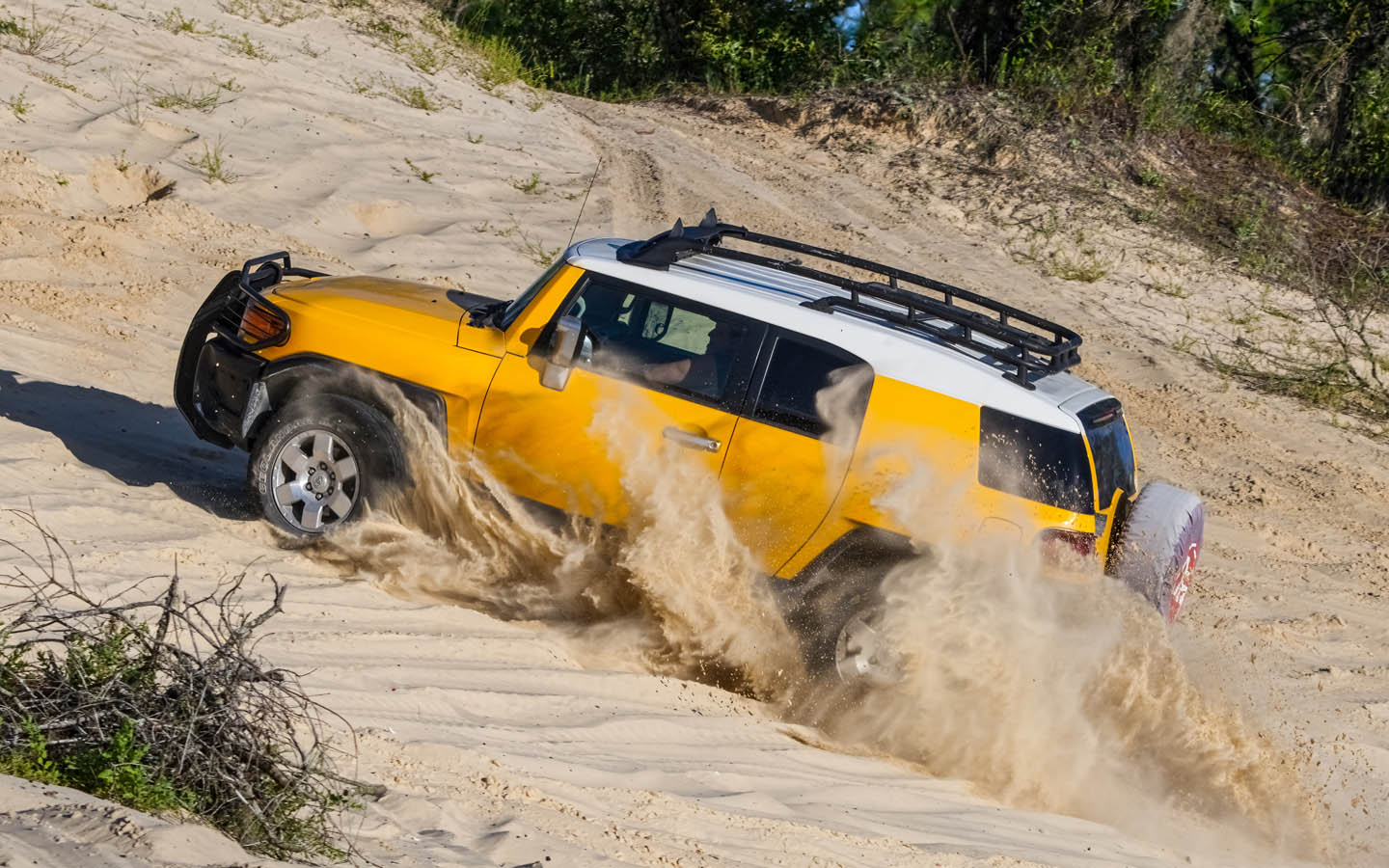 crawl control:jeep riding uphill in desert